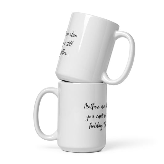 Mothers are like glue. Even when you can't see them, they're still holding the family together. Ceramic Mug